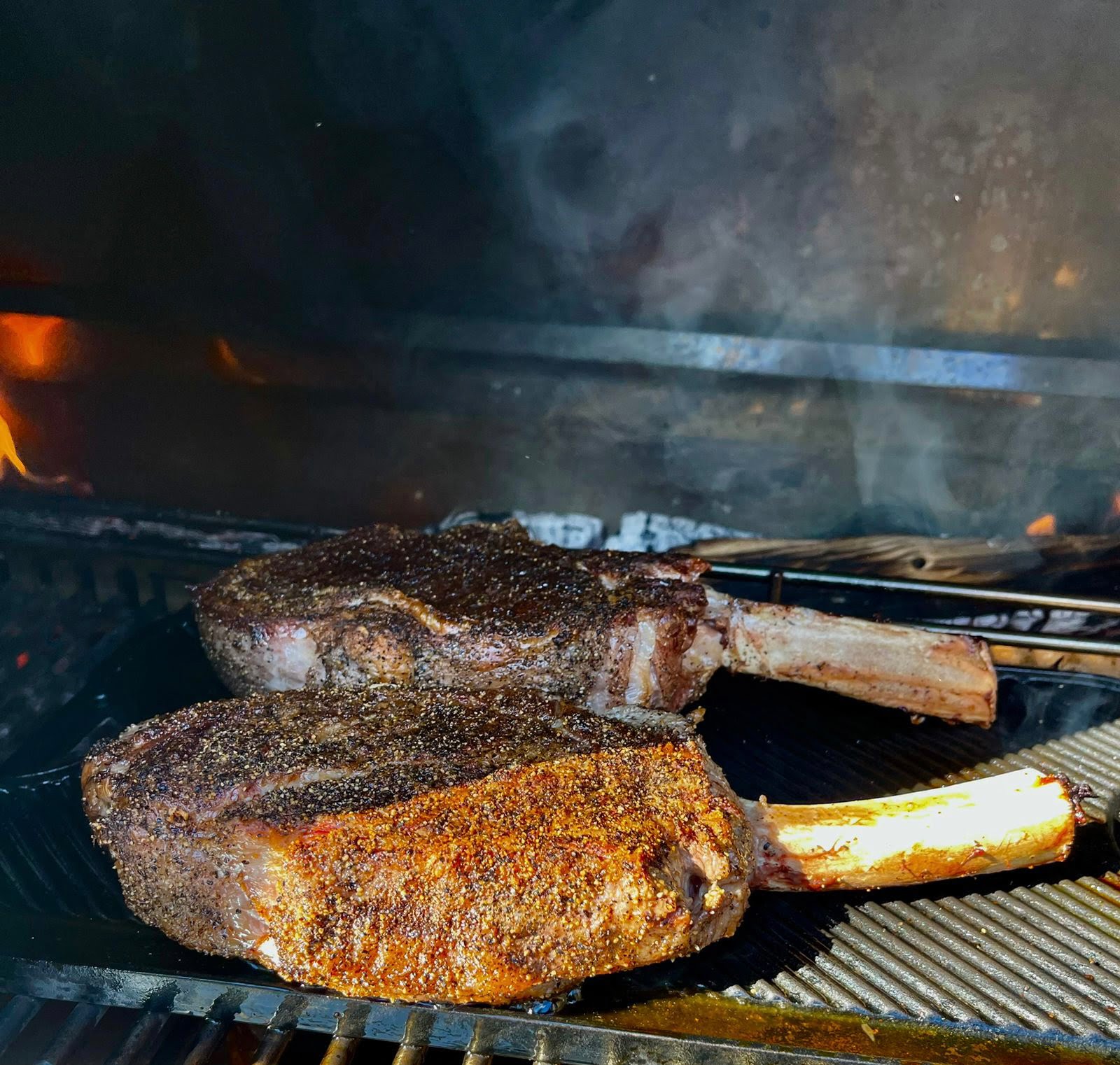 Steak sizzeling on the Engel Fires charcoal Grill